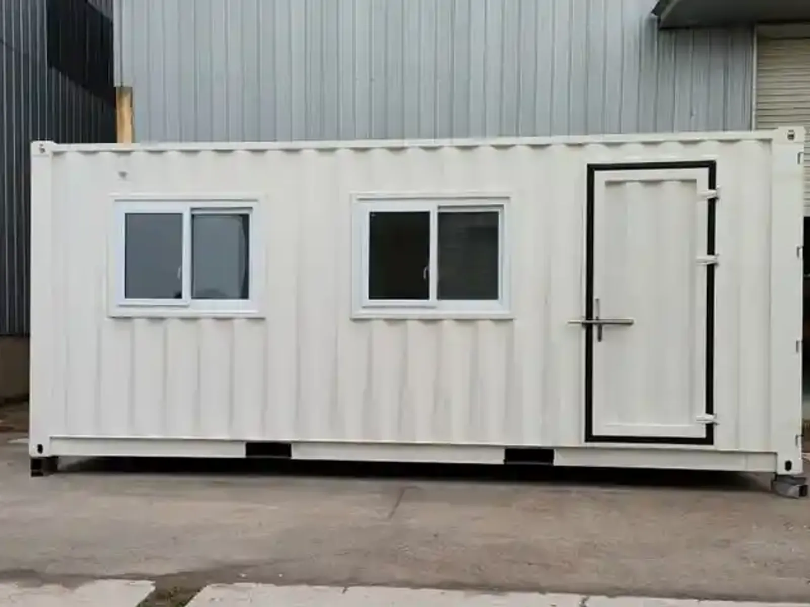 Office container exterior parked in a UAE industrial yard